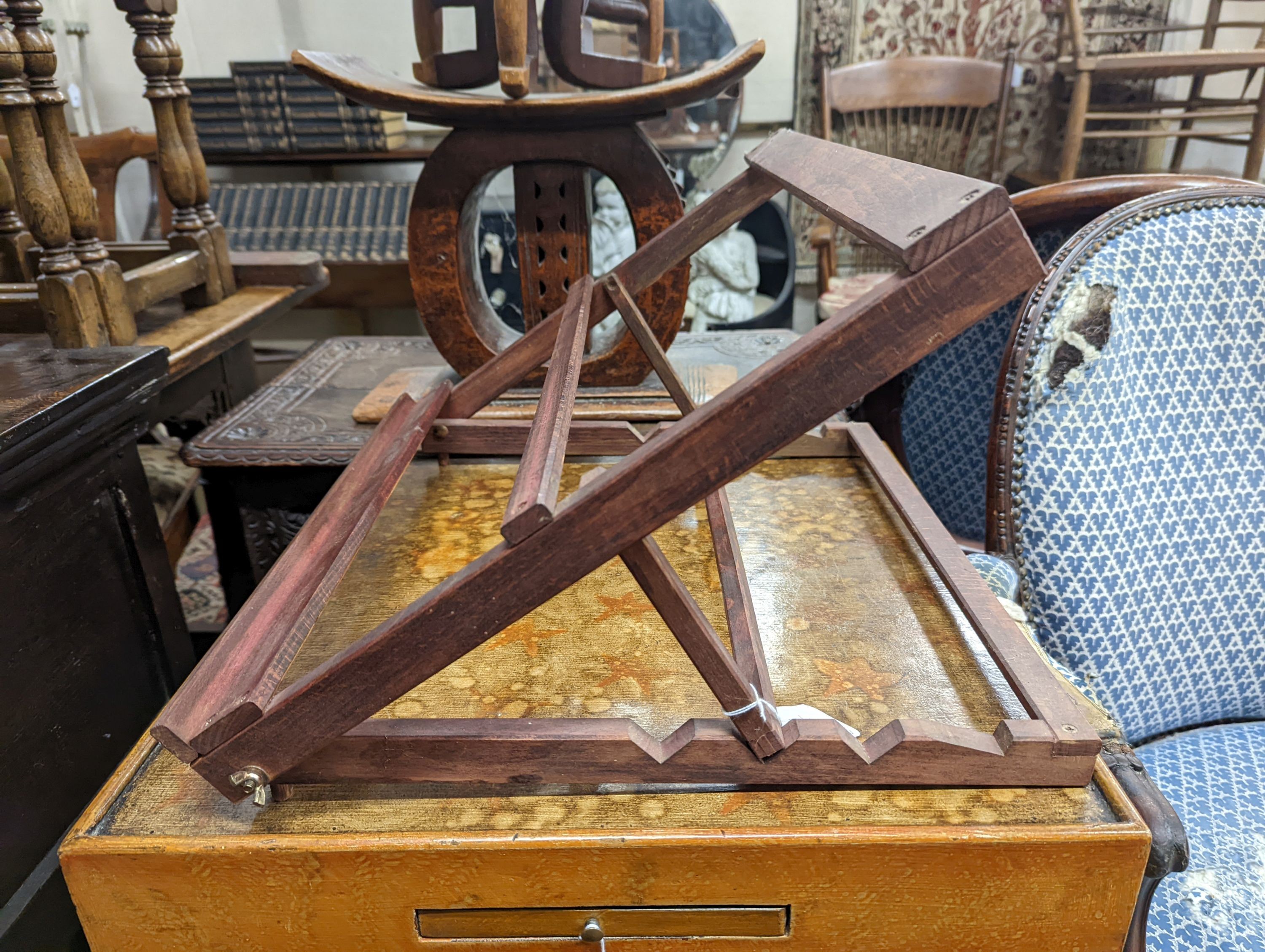 A 20th century two-tier table with scumbled finish, width 51cm, depth 51cm, height 68cm together with a table top adjustable easel